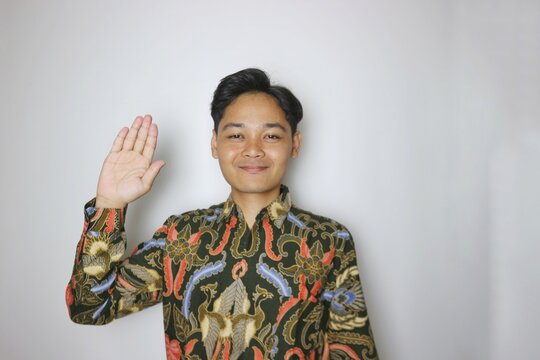 Handsome Indonesian man wearing batik with various expressions isolated white background