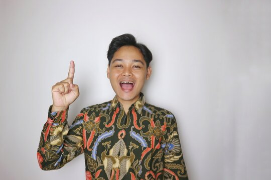 Handsome Indonesian man wearing batik with various expressions isolated white background