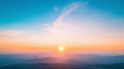 Breathtaking sunset over rolling hills, showcasing vibrant colors of orange, pink, and blue in sky. serene landscape that evokes sense of peace and tranquility.