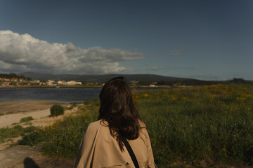 Woman walking to the beach in Cambados