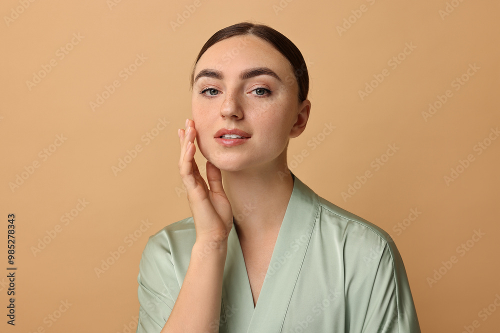 Sticker Beautiful young woman with healthy skin on beige background