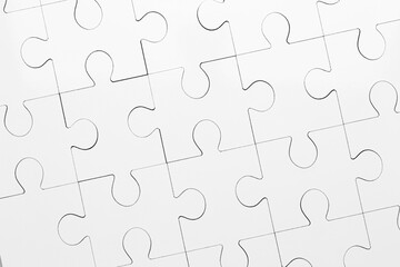 White puzzle as background, top view. Intellectual game
