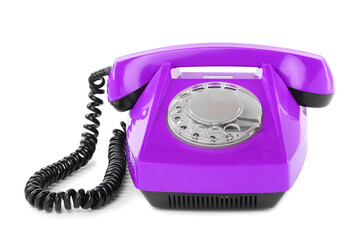 Old violet telephone with rotary dial isolated on white