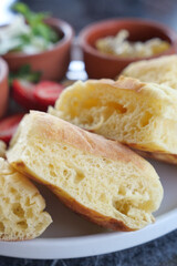 Delectably baked bread rolls derived from artisan recipes, served with a variety of accompaniments