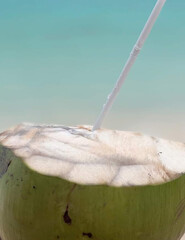 Fresh coconut juice on the beach