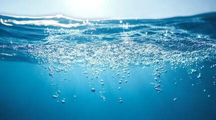 Obraz premium A serene underwater scene showcasing bubbles rising through clear blue water, highlighting tranquility and calmness in nature.