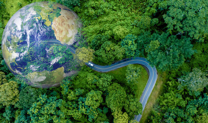Electric car and EV electrical energy for environment, EV car on forest road with earth planet going through forest, Ecosystem ecology healthy environment, Electric car with nature, Save earth energy. © Darunrat