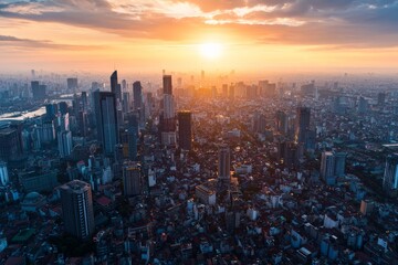 Fototapeta premium A bird's-eye view of Jakarta's sprawling cityscape at sunset, with high-rise buildings blending with traditional neighborhoods