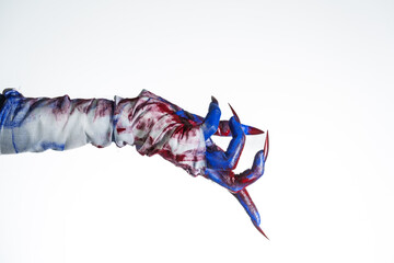 A blue witch hand with red nails, wrapped in a blood-stained bandage against a white background....