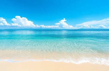 Soft, white waves lap at the shore of a pristine beach, with clear, turquoise water stretching out to a distant coastline.