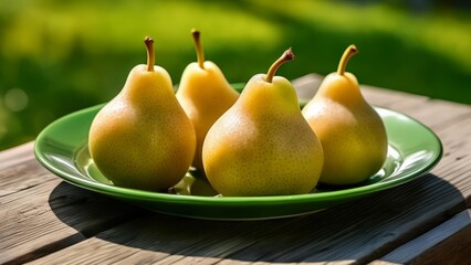  Fresh pears on a green plate ready to be enjoyed