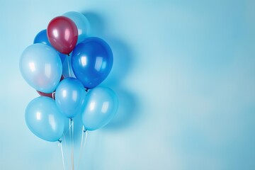 Bunch of colorful balloons on blue background. Space for text, for greeting card. Balloons in various colors, floating in air, perfect for celebration. Festive, elegant decor for party, event,
