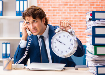 Young elegant man unhappy with too much work