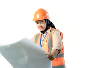 Young Asian female construction worker in hijab who looks confused when looking at the contents of a scroll of blueprints, industrial and construction concepts, isolated white background.