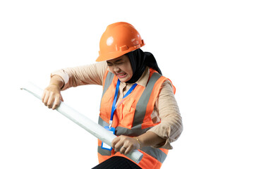 Young Asian female construction worker in hijab looking very angry wanting to slam a roll of...