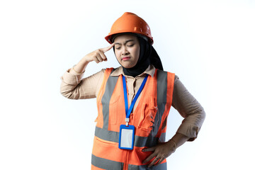 young Asian female construction worker in hijab standing and thinking with hands pointing to her head, gestru thinking, industrial and construction concept, isolated white background.