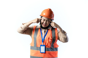 Young Asian female construction worker in hijab standing with her hands covering her ears and looking very disturbed by the noise, industrial and construction concept, isolated white background.