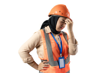 Young Asian female construction worker in hijab looking very disappointed while holding her head, industrial and construction concept, isolated white background.