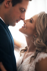 Naklejka premium Woman, man or nose touch at wedding for love, affection or commitment in relationship. Couple, newly wed or happy in marriage with hug, support or promise in matrimony or together for first dance