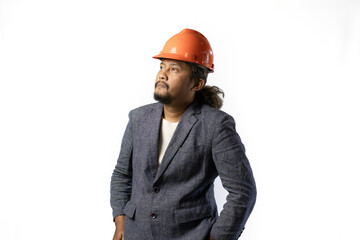 optimistic mens expressions and gestures thinking. stylish asian man with suit and orange helmet on white background. construction or mining business concept photo