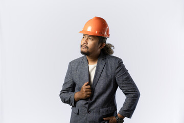 optimistic mens expressions and gestures thinking. stylish asian man with suit and orange helmet on white background. construction or mining business concept photo