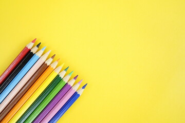 Colorful Pencils on Yellow Background