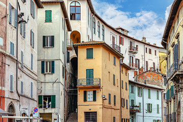 Obraz premium The narrow, cobblestone streets of Perugia, where ancient stone buildings and arches create a captivating atmosphere steeped in history. Perugia, Umbria, Italy.