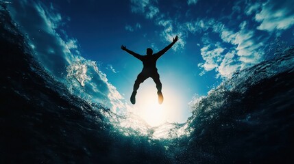 A silhouette of a person diving into the ocean against a stunning sunset backdrop, capturing the essence of freedom and adventure.