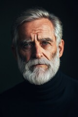 Obraz premium Close-Up Portrait of a Mature Man with Grey Hair and Beard, Expressive Eyes, and Strong Features