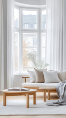 Bright and airy living room featuring a cozy sofa and natural elements in a modern home setting