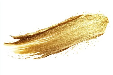 Fototapeta premium A shimmering gold glitter brush stroke on a white background, ideal for design projects.