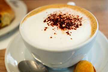 cappuccino coffee with frosted milk served in a bakery breakfast in Paris, France