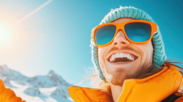 A couple smiling brightly as they stand at the summit of a mountain, enjoying the breathtaking views and celebrating their adventurous achievement.