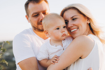 Happy Family Enjoying Quality Time Outdoors With Adorable Baby