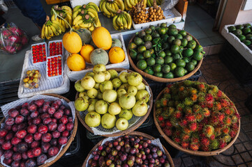 assortment of various tropical exotic fruits at a street market in Vietnam in Asia
