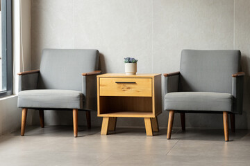 Two chairs and a small table are arranged in a living room.