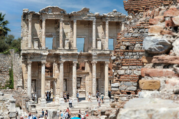 Photo of Celsius library and marble columns in the ephesus ancient city . Cultural and historical tourism concept. Efes Izmir Turkey.