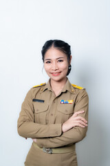 Female Thai government officer in khaki uniforms smiling. Beautiful woman doing winner gesture with arms raised isolated over white background. Concept