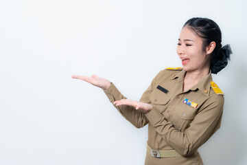 Female Thai government officer in khaki uniforms smiling. Beautiful woman doing winner gesture with arms raised isolated over white background. Concept