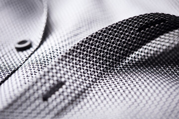 Close up of dark Men's shirt. Soft focus. Copy space.	