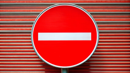 No entry sign in bright red with a horizontal white line through the middle