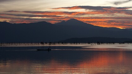 Beautiful sunset atmosphere on Lake Kerinci, Indonesia with Mount Kerinci in the background
