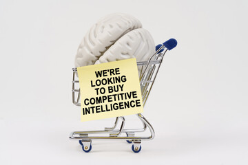 A clever cart carrying a brain with a note seeking competitive intelligence for purchase