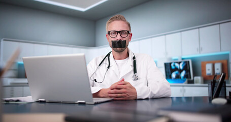 Medical Doctor With Black Duct Tape Over His Mouth