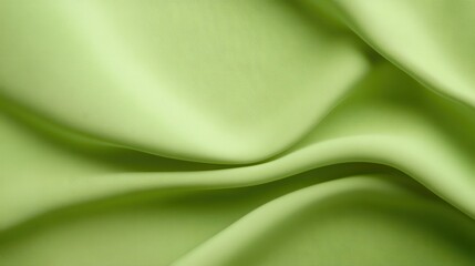 Green fabric texture background with a soft, natural weave, ideal for calming and organic visuals.