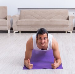 Young man training and exercising at home