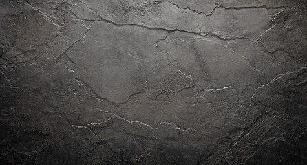 Naklejka premium Rough black wall with a grainy stone texture background