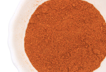 Crushed red chili pepper. Spice in a round white bowl. Isolate on a transparent background. Cooking ingredient png
