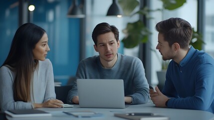Three Professional Educators Interacting During a Productive Meeting with Clean Laptops