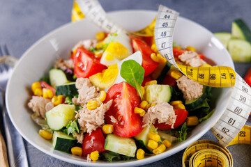 Healthy Salad with Measuring Tape – Diet and Weight Loss Concept